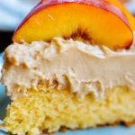 Peach Cake with Brown Sugar Frosting: A Moist, Dreamy Dessert 5 Close-up of a moist peach cake slice topped with brown sugar frosting and peach slices