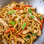 Super Easy Chicken Lo Mein with stir-fried chicken, vegetables, and Chinese noodles in a savory sauce, served in a wok.