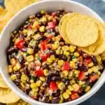 Black Bean Corn Salsa – Easy, Fresh & Flavor-Packed Dip or Side 12 Fresh black bean corn salsa with tortilla chips in a white bowl on a striped cloth