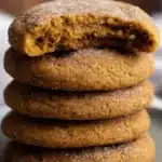 Chewy Pumpkin Cookies – Soft, Spiced & Perfectly Fall-Flavored 9 Stack of chewy pumpkin cookies with a sugar-dusted top cookie missing a bite, showing soft and moist inside