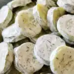 Creamy Cucumber Salad – Cool, Tangy & Quick to Make 6 Close-up of creamy cucumber salad with dill dressing on sliced cucumbers