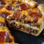 Deep Hamburger Sausage & Pepperoni Pie: Meaty, Cheesy Dinner Perfection 5 Deep-dish hamburger sausage and pepperoni pie with melted cheese and golden crust, served fresh with crispy edges