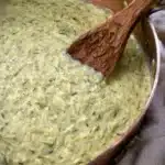 Creamy Zucchini Sauce Recipe – Rich & Lusciously Smooth 12 Creamy zucchini sauce simmering in a skillet with wooden spoon and fresh herbs