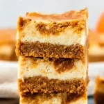 Pumpkin Cheesecake Bars – Easy, Creamy Fall Favorite 9 Stack of marbled pumpkin cheesecake bars with creamy swirls and graham cracker crust
