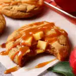 Caramel Apple Cookies – Soft, Chewy & Amazingly Good Fall Treat 12 Close-up of caramel apple cookies with drizzled caramel and fresh apples on parchment
