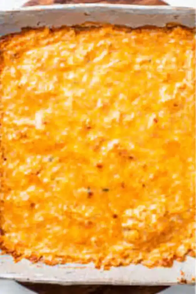 Buffalo Chicken Dip Recipe (Easy, Creamy & Crowd-Pleasing) 10 Freshly baked Buffalo chicken dip with melted golden cheese in white baking dish