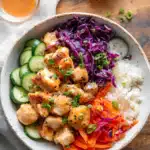 Bang Bang Chicken Bowls | Quick & Easy Dinner Idea 8 Bang Bang Chicken Bowls with crispy chicken, sautéed carrots, red cabbage, cucumber, jasmine rice, green onion, sesame seeds