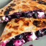 Blueberry Breakfast Quesadilla | Quick & Tasty Morning Win 9 Crispy blueberry breakfast quesadilla with creamy cheese and juicy berries on a plate