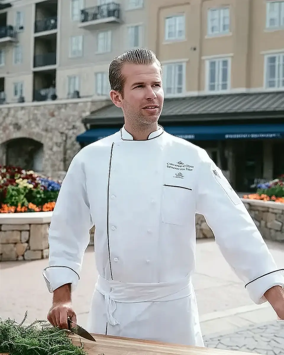 About Me 5 Chef Kai of Kai Recipes preparing gourmet food at an elegant outdoor cooking station