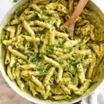 Creamy Chicken Pesto Pasta | Amazing Weeknight Dinner 9 Overhead shot of creamy chicken pesto pasta in skillet with seared chicken and vibrant pesto sauce