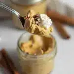Pumpkin Fluff – Light, Easy & Delicious 10 Spoonful of pumpkin fluff dessert with whipped cream and pecans above a glass jar