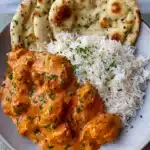 Easy Homemade Butter Chicken – Simple & Sensational Dinner 10 Easy homemade butter chicken served with rice and naan on a ceramic plate