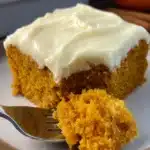 Easy Pumpkin Carrot Cake Recipe That’s Cozy and Quick 9 Slice of easy pumpkin carrot cake with cream cheese frosting and fork on plate