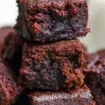 Zucchini Brownies – Fudgy, Healthy, Irresistible 12 Close-up of moist, fudgy zucchini brownies stacked on a plate