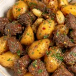 Garlic Butter Steak and Potatoes | Quick & Delicious Dinner 6 Garlic Butter Steak and Potatoes in a rustic bowl, coated with garlic herb butter and garnished with parsley