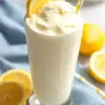 Chick-fil-A Frosted Lemonade Recipe | Sweet, Creamy & Quick 8 Creamy Chick-fil-A frosted lemonade in a tall glass with vanilla ice cream and lemon garnish