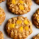 Peach Oatmeal Breakfast Cookies : Soft & Wholesome 8 Soft peach oatmeal breakfast cookies with bright peach chunks on rustic table