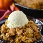 Pumpkin Crisp Recipe | Easy & Cozy Fall Dessert 9 Pumpkin Crisp Recipe with golden streusel topping and vanilla ice cream in a rustic bowl