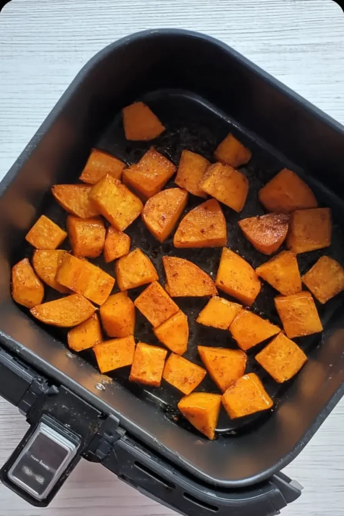 Air Fryer Pumpkin | Quick, Healthy & Delicious Side 9 Pumpkin chunks in a single layer inside air fryer basket