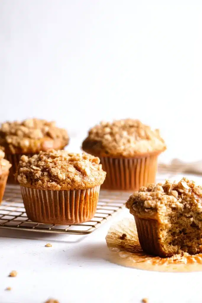 Apple cinnamon muffins with oat crumble on cooling rack