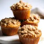 Stack of apple cinnamon muffins with oat topping