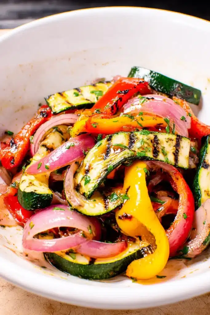 Balsamic Grilled Vegetables – Easy & Flavorful Summer Side 7 Grilled vegetables tossed in balsamic dressing with parsley in a white bowl