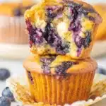 Blueberry Cottage Cheese Muffins – Easy & Delicious Bake 9 Close-up of blueberry cottage cheese muffins stacked with one halved, showing moist interior and juicy berries.