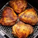 Crispy Air Fryer Chicken Thighs for a Delicious Dinner 9 crispy air fryer chicken thighs in basket