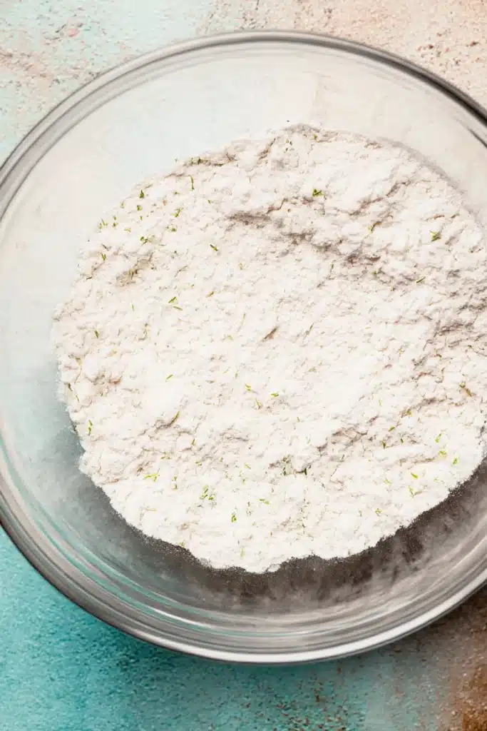 Garlic Butter Bread Rolls (Soft, Fluffy & Flavor-Packed) 12 Glass mixing bowl with all-purpose flour and chopped parsley, ready for bread dough