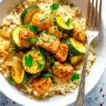 Easy Baked Chicken and Zucchini | Quick & Flavorful Dinner 6 Easy Baked Chicken and Zucchini served over rice with fresh parsley and paprika