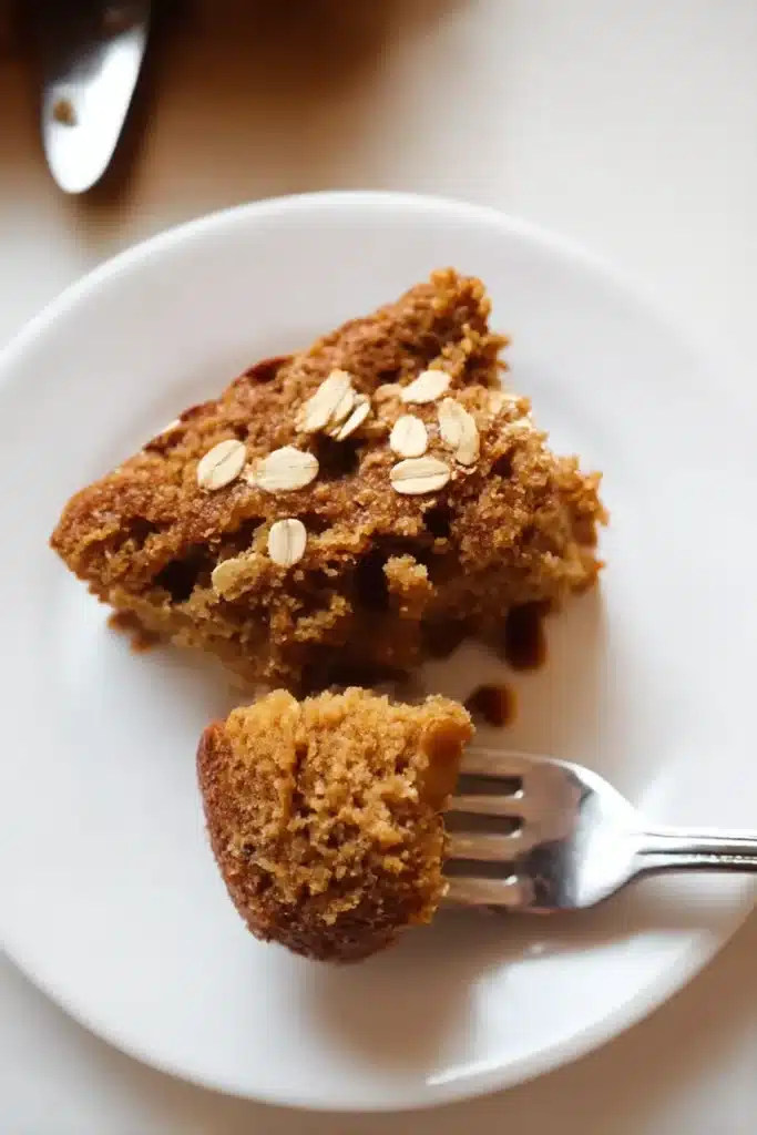 Easy Breakfast Oatmeal Apple Cake – Healthy & Quick Treat 15 easy breakfast oatmeal apple cake slice with fork lifting a bite