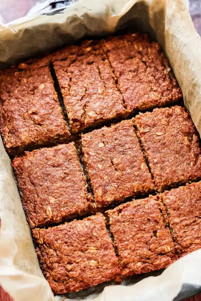 Easy Breakfast Oatmeal Apple Cake – Healthy & Quick Treat 12 easy breakfast oatmeal apple cake baked in a parchment-lined pan