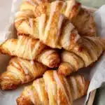 Easy Crescent Roll Apple Turnovers fresh from the oven with glaze