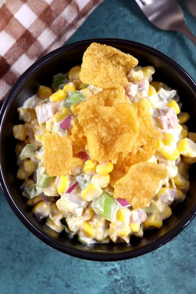 Frito Corn Salad – Ultimate Crunchy Summer Favorite 10 Bowl of creamy Frito Corn Salad topped with whole chili cheese chips