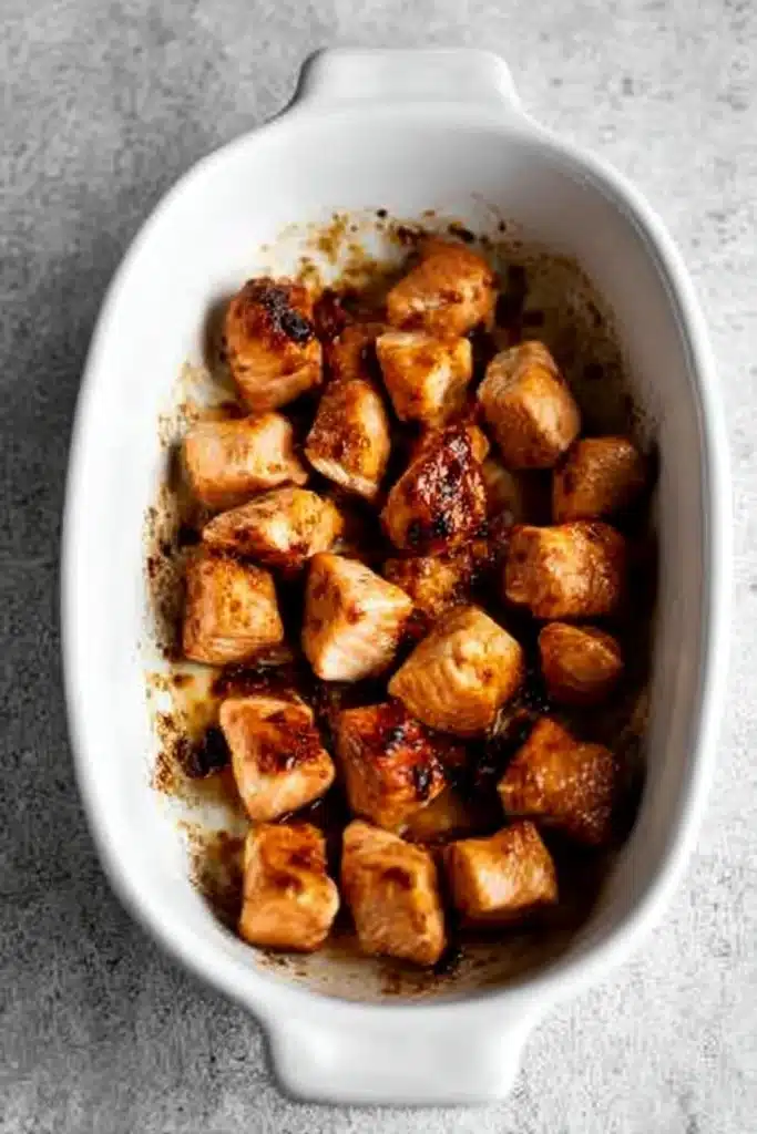 Baked Teriyaki Salmon Recipe with golden-brown salmon cubes in baking dish