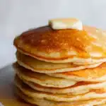 Easy oatmeal apple pancakes with melting butter and maple syrup