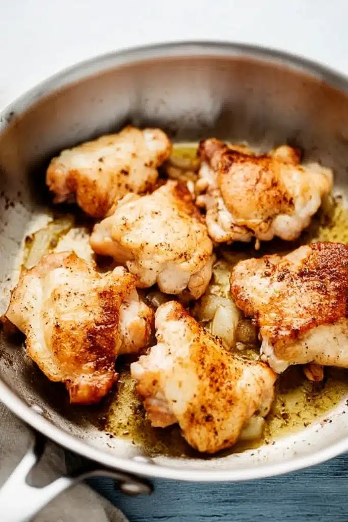 Creamy Oven Baked Chicken Thighs | Easy & Flavorful Dinner 10 Seared chicken thighs for creamy oven baked chicken thighs recipe
