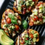 Grilled California Avocado Chicken | Easy & Juicy Dinner 8 Grilled California avocado chicken topped with mozzarella, tomato, and basil in a skillet