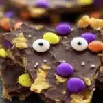 Halloween Crack | Sweet, Crunchy, and Fun to Make 12 Halloween Crack toffee with chocolate, candy eyes, and festive Halloween sprinkles