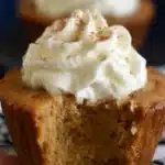 Easy Pumpkin Pie Cupcakes – Simple, Seasonal & Delicious 9 Easy Pumpkin Pie Cupcakes topped with whipped cream and cinnamon, with a moist custard-like center and a visible bite
