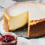 New York Style Cheesecake – Creamy, Rich & Delicious 12 Classic New York style cheesecake with graham cracker crust and strawberry topping