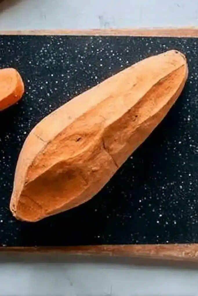 Peeled roasted sweet potatoes on cutting board