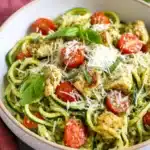 Pesto Zucchini Noodles with Chicken | Fresh & Delicious 8 Pesto Zucchini Noodles with Chicken topped with cherry tomatoes, parmesan, and fresh basil