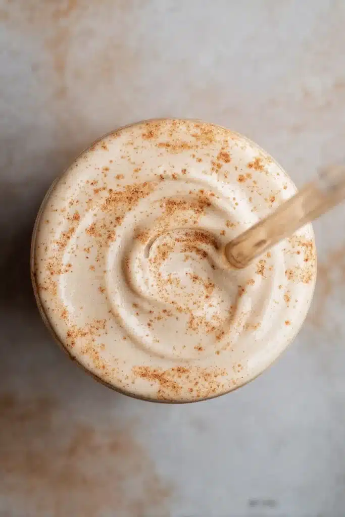 Top-down view of pumpkin cream cold brew with creamy pumpkin spice foam