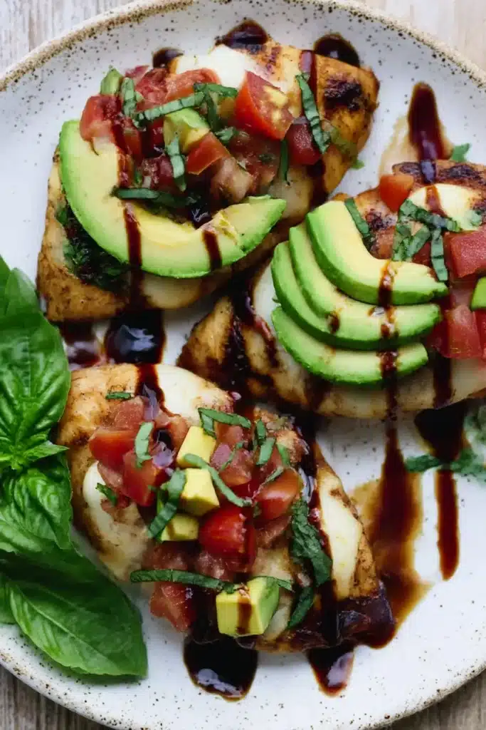 Grilled California Avocado Chicken | Easy & Juicy Dinner 9 Grilled California avocado chicken plated with mozzarella, tomato, basil, and balsamic drizzle