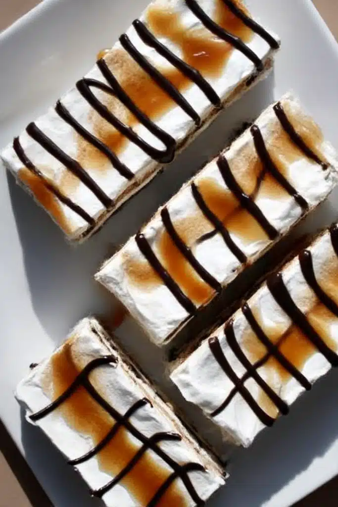 Lazy ice cream sandwich cake slices with caramel and chocolate drizzle