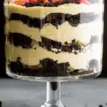 The Best Oreo Dirt Cake – Fun, Creamy, Crowd-Pleaser 12 The Best Oreo Dirt Cake layered in a glass trifle bowl with gummy worms on top