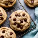 Chewy Chocolate Chip Cookies | Soft, Thick & Delicious 18 Close-up of chewy chocolate chip cookies cooling on a wire rack with gooey chocolate chips and golden-brown texture
