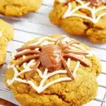 Spiced Pumpkin Cookies – Soft, Sweet & Perfect for Fall 8 spiced pumpkin cookies with white chocolate web and chocolate spider on top
