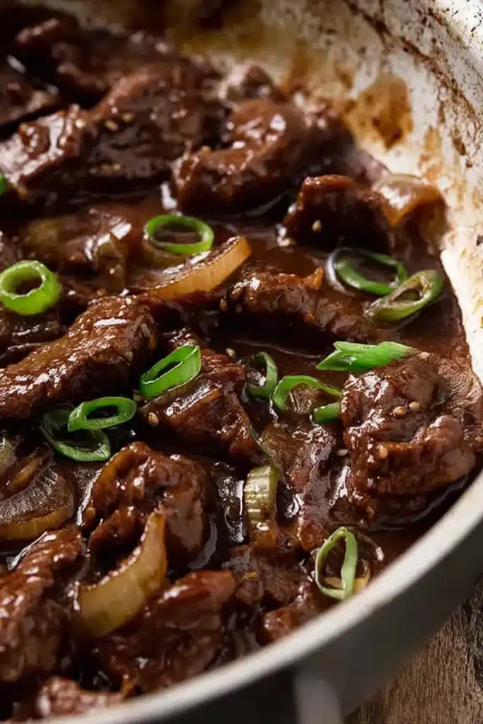 Beef Stir Fry with Honey Pepper Sauce | Quick & Delicious 8 Close-up of beef stir fry with honey pepper sauce simmering in pan